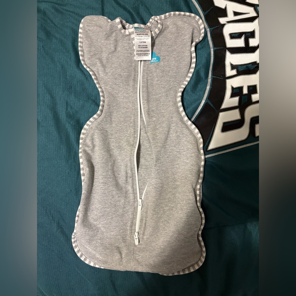 Gently used newborn size love to dream swaddle, worn few times